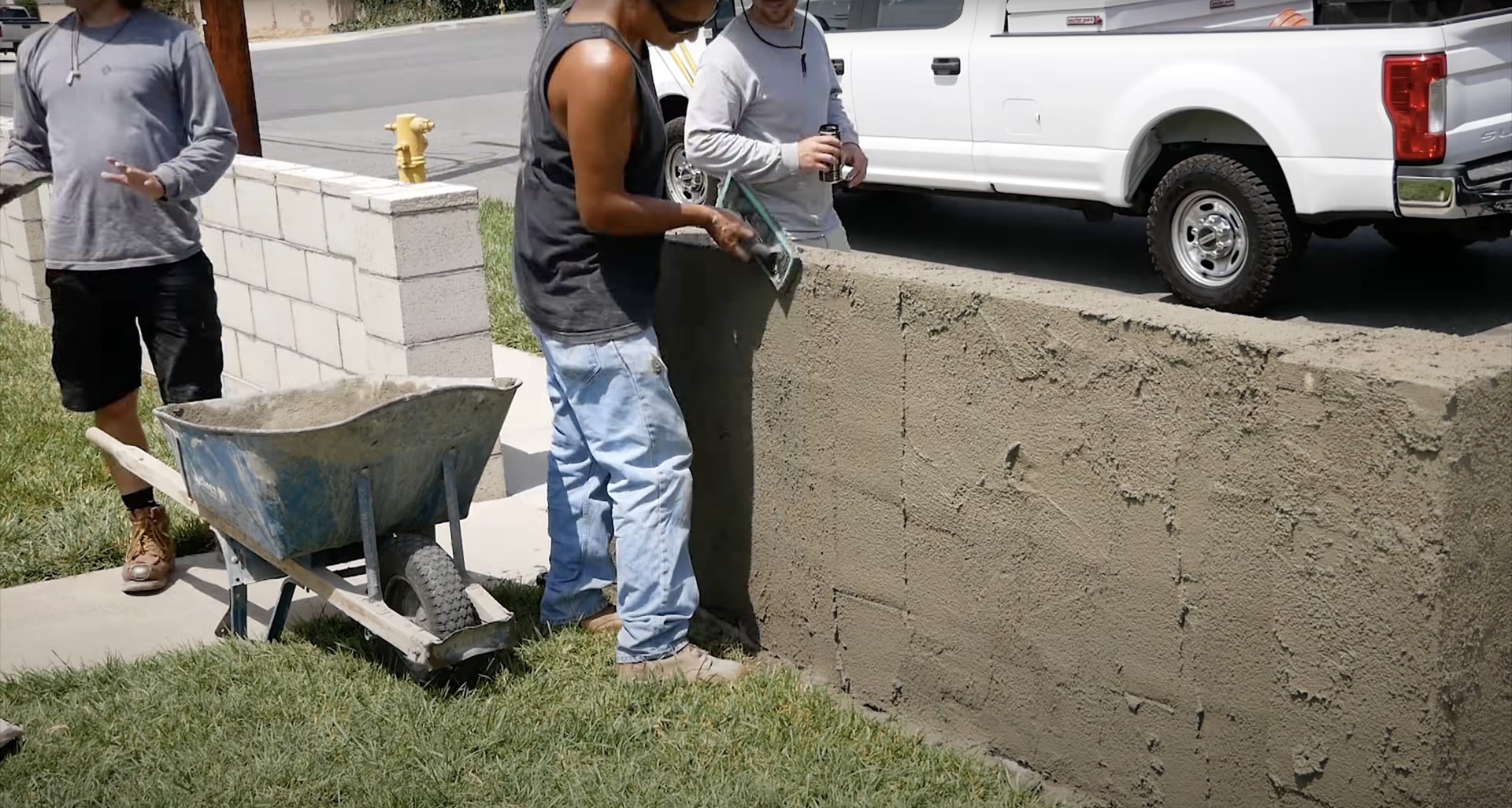 Concrete construction team working on residential driveway project