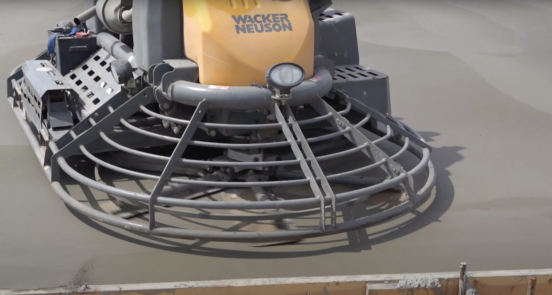 Professional concrete finishing equipment showing power trowel used for smooth concrete surfaces