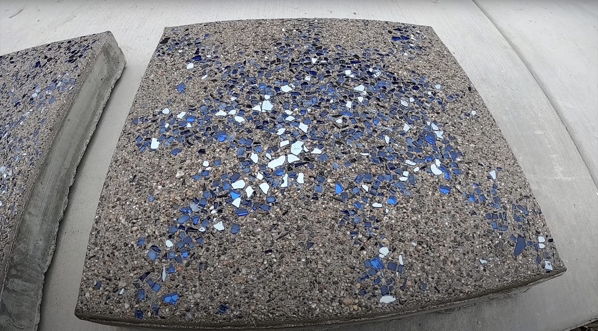 Decorative concrete surface with blue glass aggregate showing quality finish