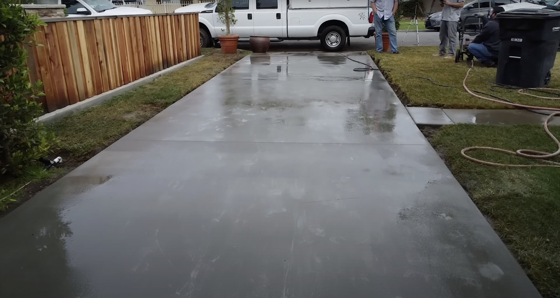 Finished concrete driveway installation showing smooth, professional finish