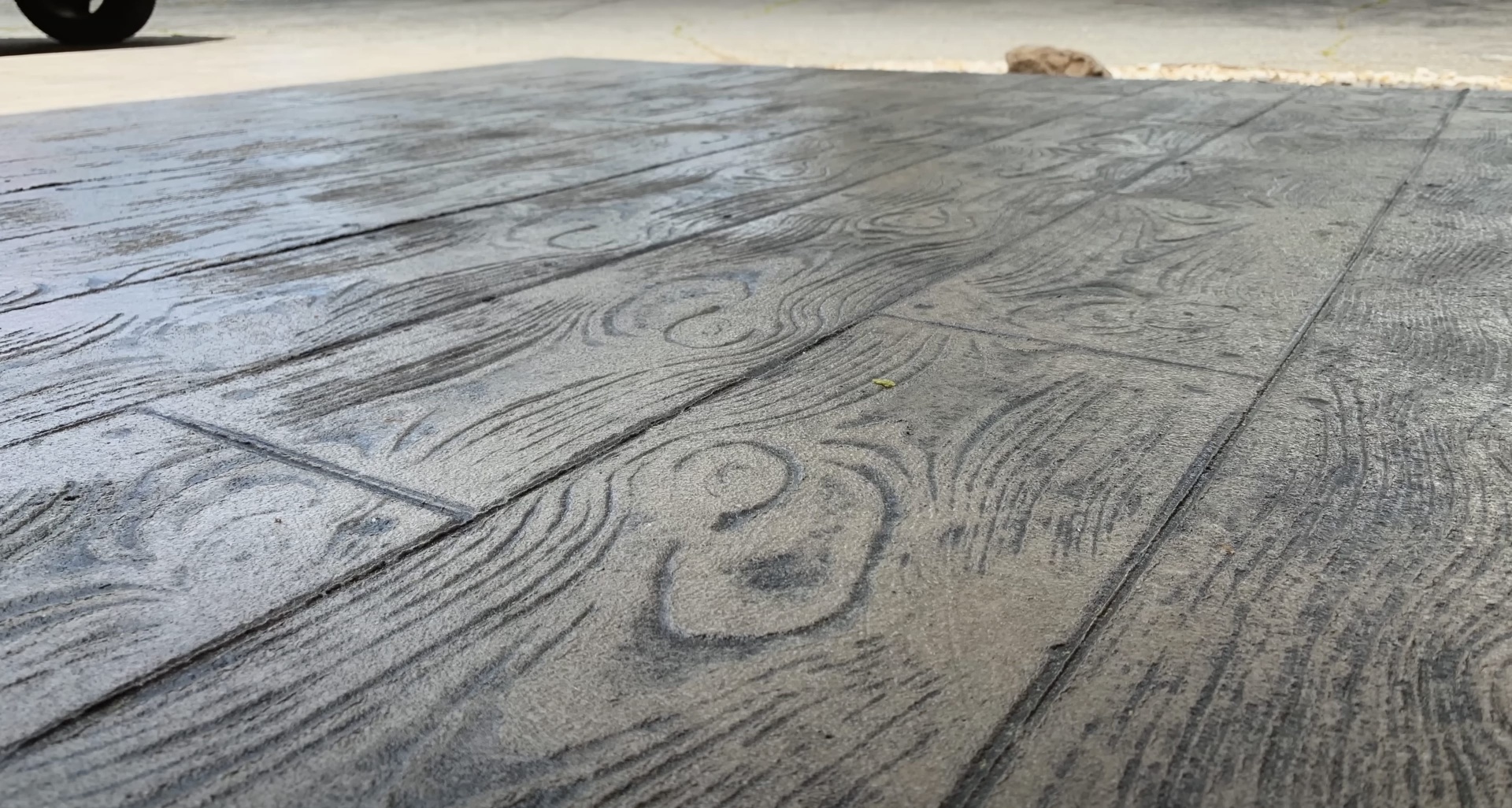 Decorative stamped concrete surface showing wood plank pattern design